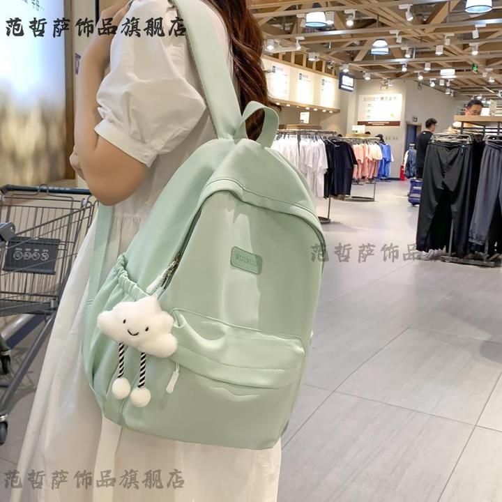 日系简约双肩包大容量高级感休闲背包男多功能纯色女大学生书包潮