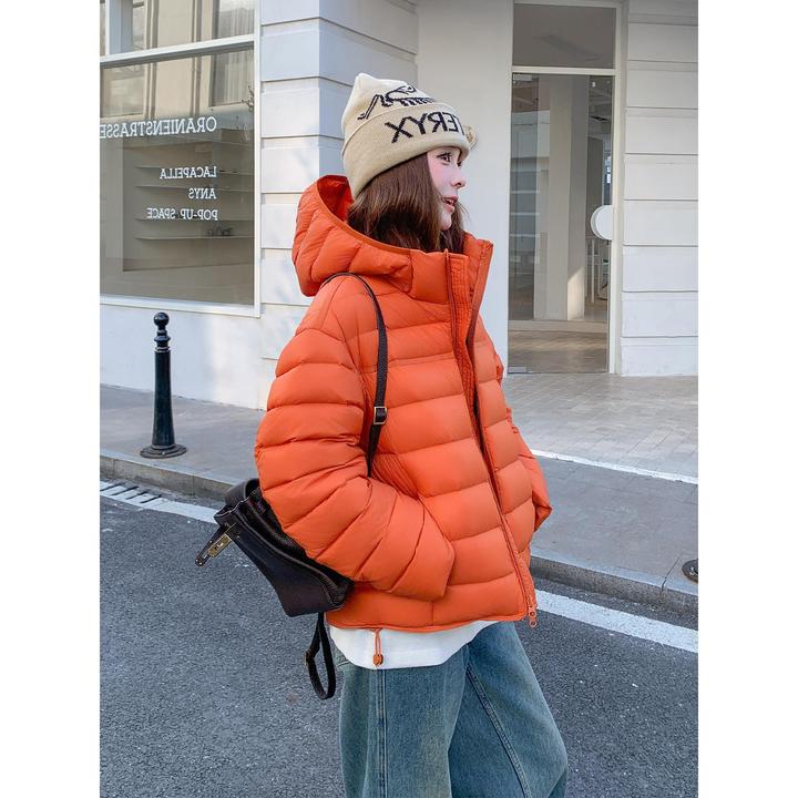 橙色高级感时髦洋气排骨羽绒服女2025冬新款韩系保暖连帽90绒外套
