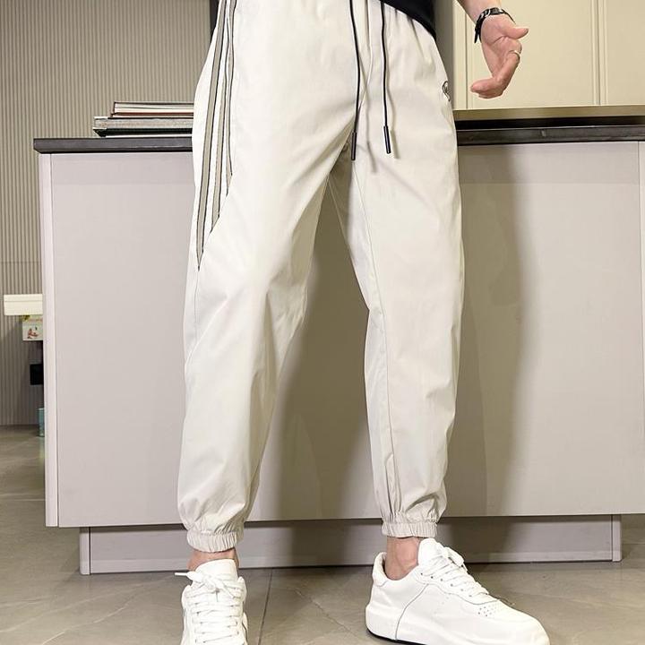 男装裤子男夏季新款拼接速干休闲裤男士潮牌束脚九分运动裤百搭