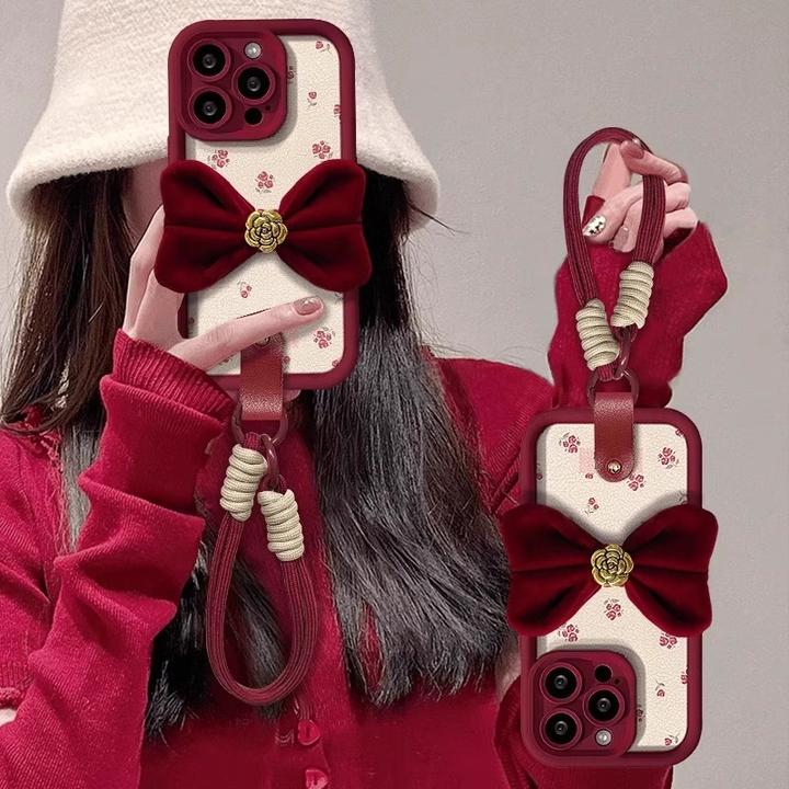 山茶花蝴蝶结挂绳适用苹果16promax手机壳iPhone16碎花小羊皮硅胶