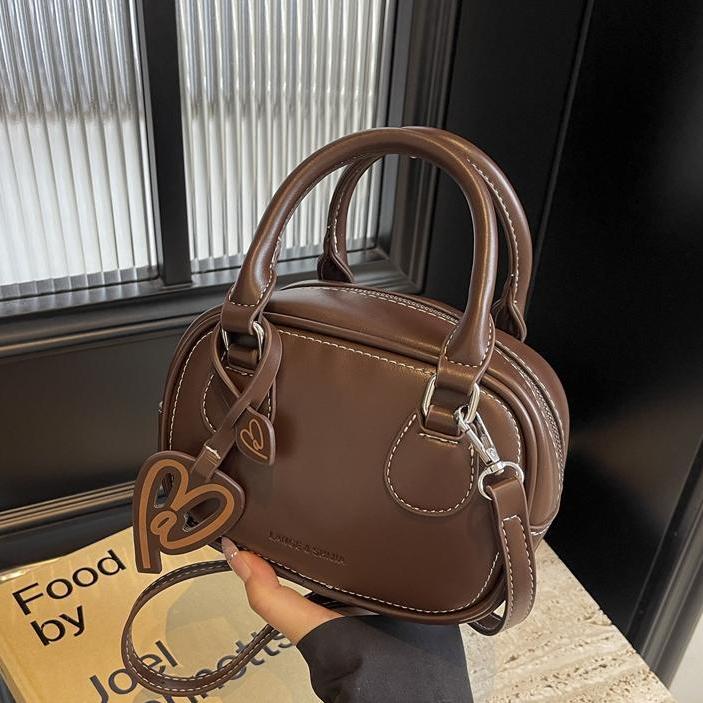 左九女包小众时尚手拎枕包新款复古高级感百搭单肩包简约休闲女士