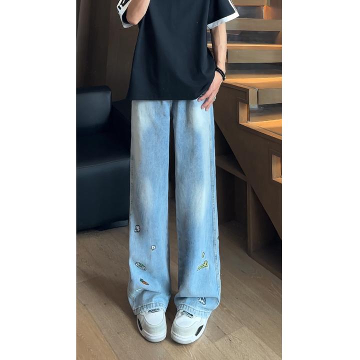 蓝色刺绣牛仔裤男美式高街痞帅高级感裤子美式高街趣味卡通微喇裤