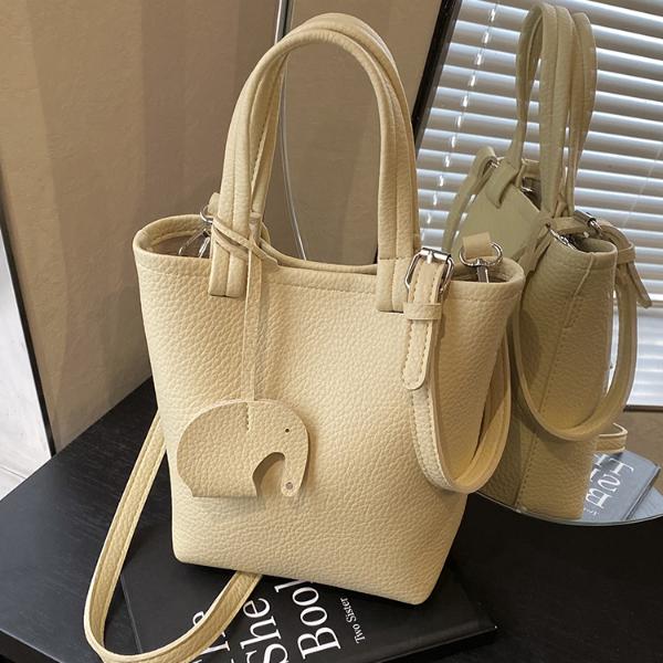 简约休闲手提水桶包包女2025新款春夏小清新单肩包通勤百搭斜挎包