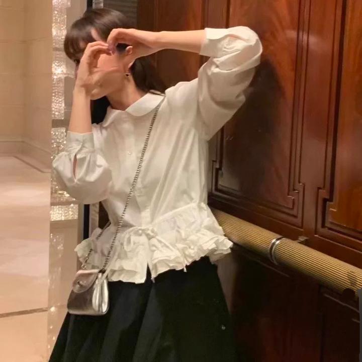 蓬松花瓣下摆衬衫2025新款春季压褶白色花边娃娃领长袖衬衣