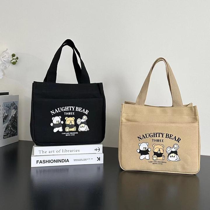 拉链外侧兜帆布手提包多口袋妈咪包卡通便携饭盒包通勤女包零食包