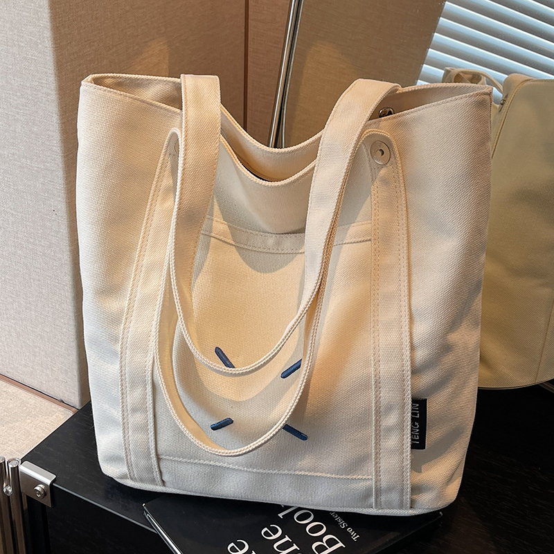 大容量帆布包女2025新款时尚单肩包百搭上课通勤托特包短期旅行包