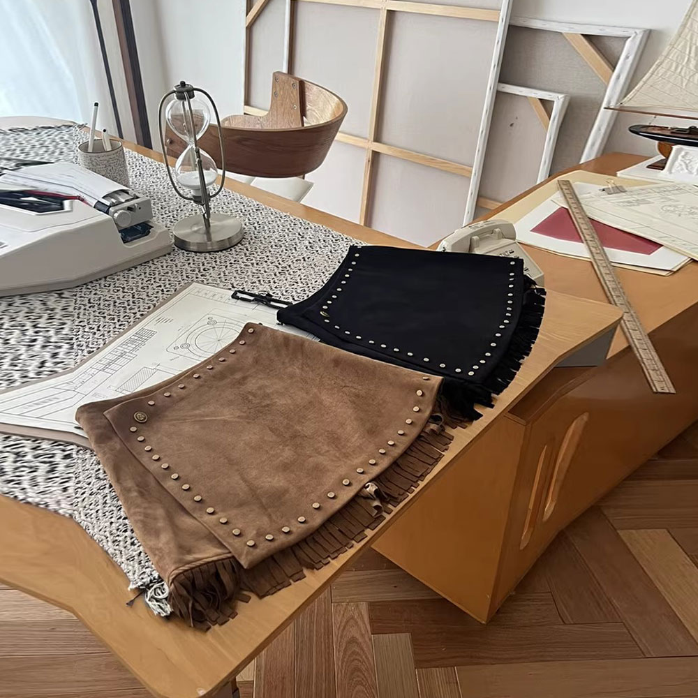 复古重工半身裙女2025年秋冬新款高腰纯色流苏短裙遮肚显瘦a字裙