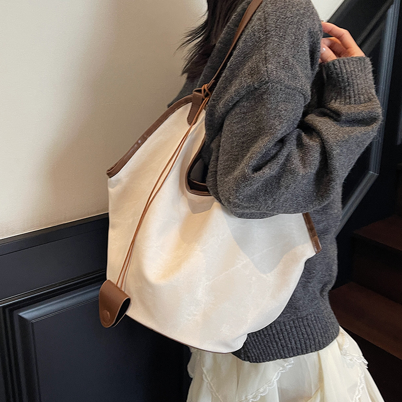 休闲大容量牛仔布包包女式2025新款百搭通勤单肩包外出上班托特包