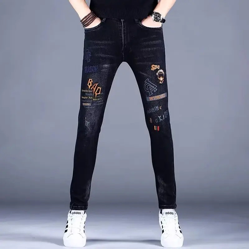 男士黑色牛仔裤2025年新款休闲百搭潮牌刺绣春秋款修身爆款长裤子