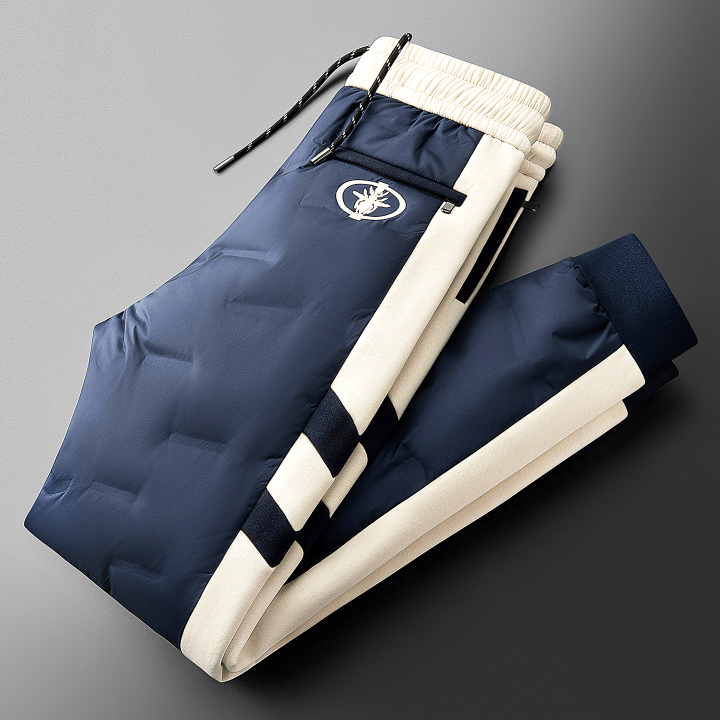 贾鲁萨加高端时尚冬季保暖加厚男潮牌防水拼接情侣小脚休闲羽绒裤