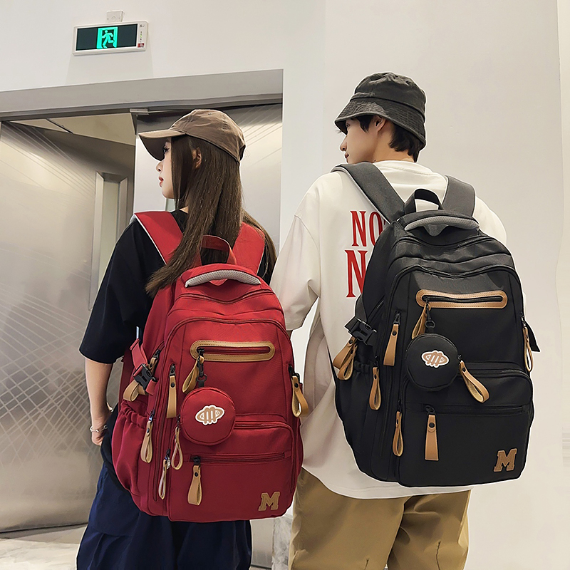 初中生书包大学生男孩三到六年级小学生轻便大容量高中生双肩包