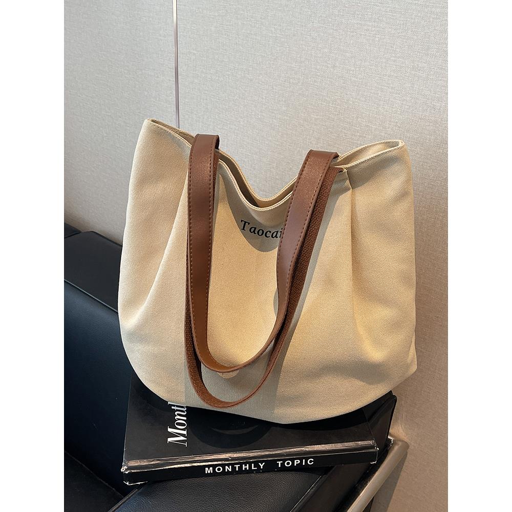 简约休闲帆布包包女2025新款单肩托特包百搭大容量学生上课通勤包