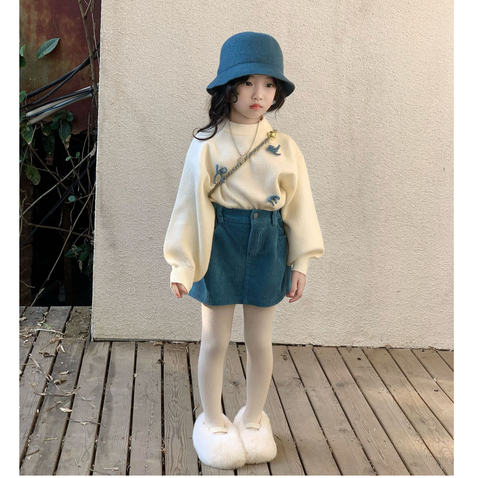 2025冬季新款女童高级感保暖蝴蝶结针织毛衣可爱秀气坑条短裙套装