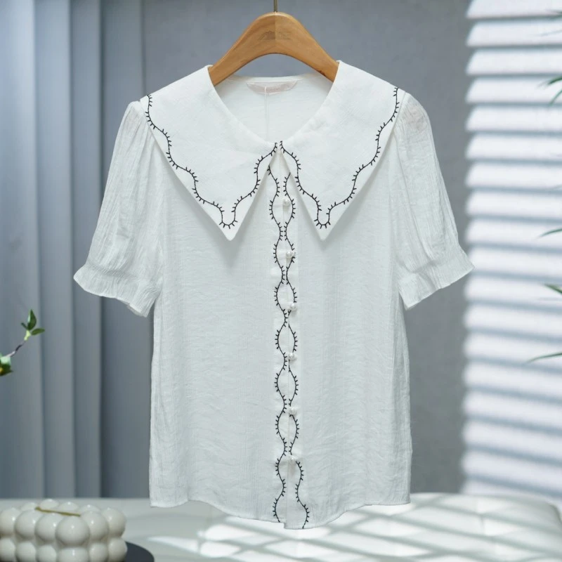 咏系列   Y708   女装时尚撤柜短袖小衫米白B3130204