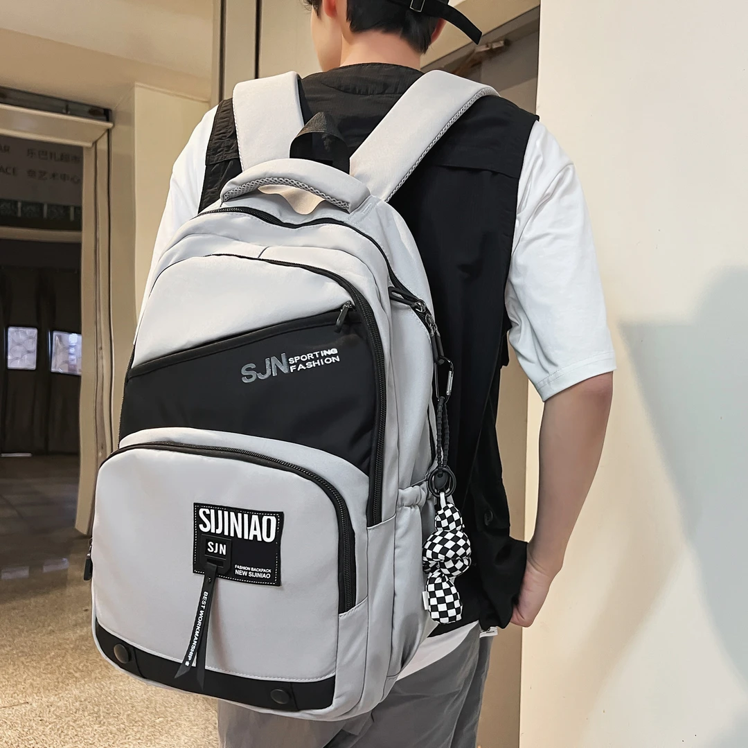 时尚个性潮流ins日系韩版户外百搭斜拼色小标男士大容量双肩背包