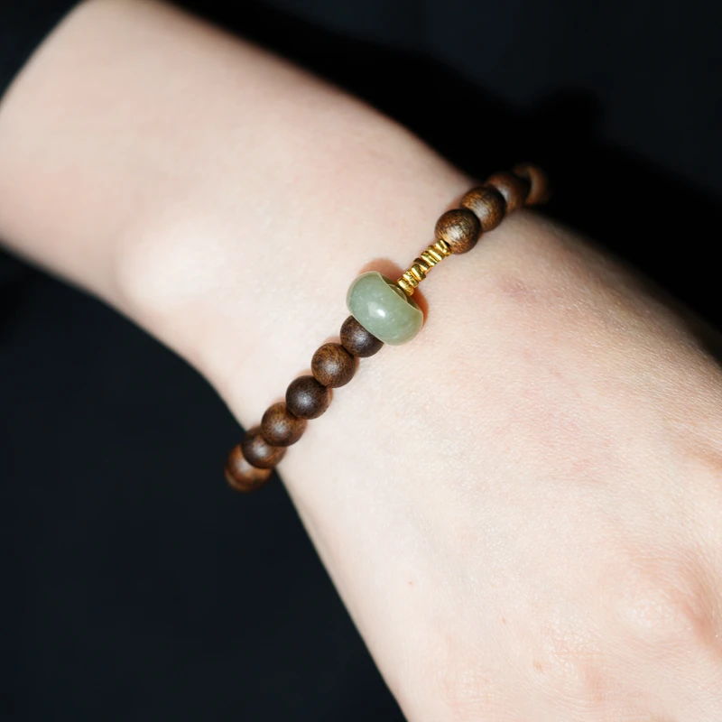 海南莺歌绿全沉水级沉香搭配和田玉跑环设计款手串cx0043b0324