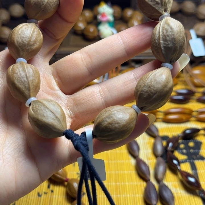 橄榄核核雕梅林铁核1.9*2.7