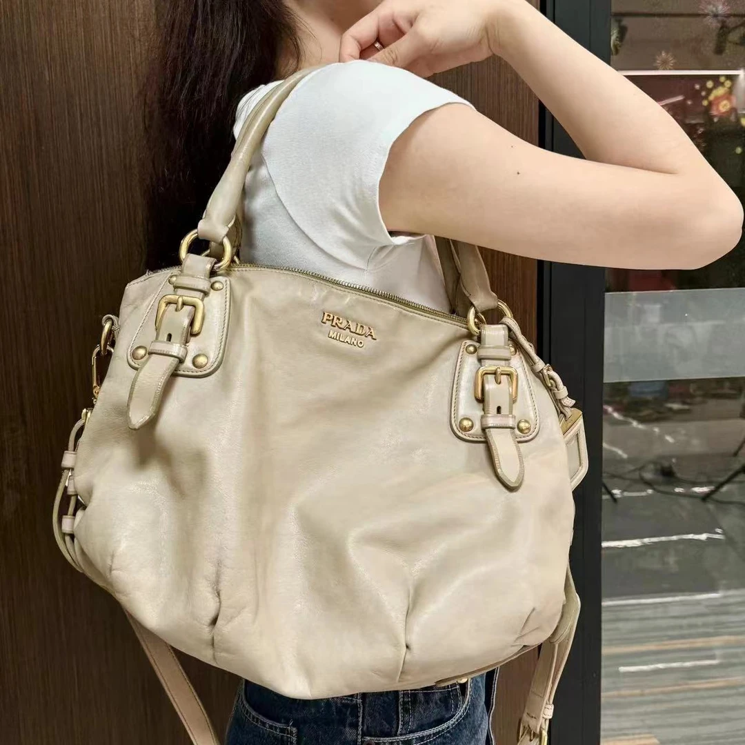 95新 Prada/普拉达 XM/甜辣慵懒感机车手提斜挎包/SH06128095