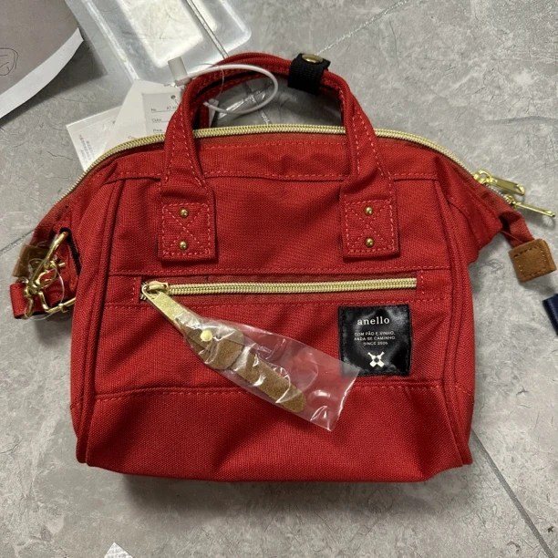 乐T橙红色手拎斜挎包 五金稍有磨损 介意勿拍