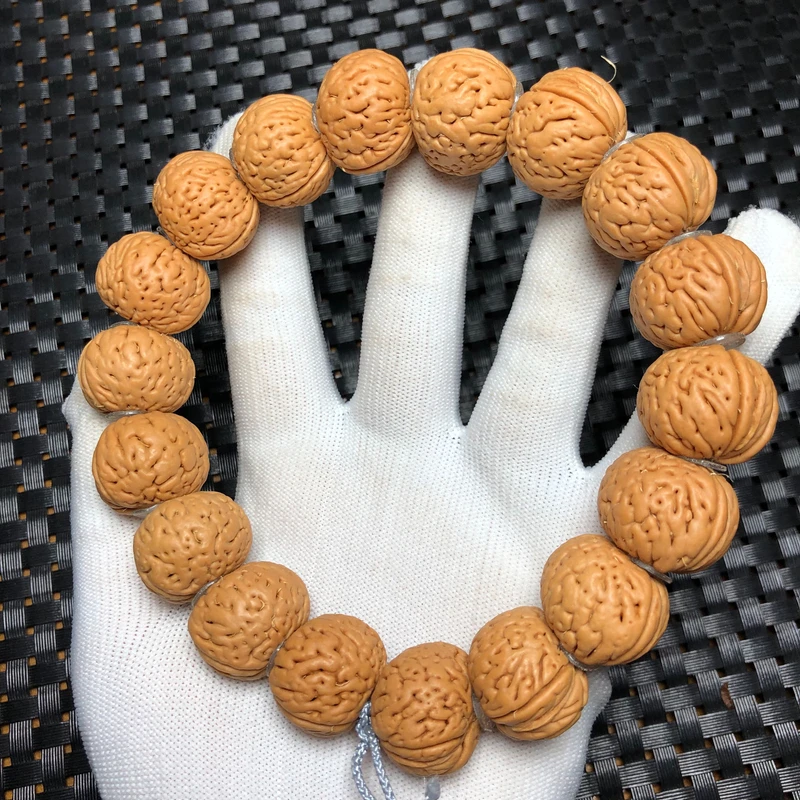 珠串03111芭蕉扇桃核手持21-22mm左右18颗密纹桃核