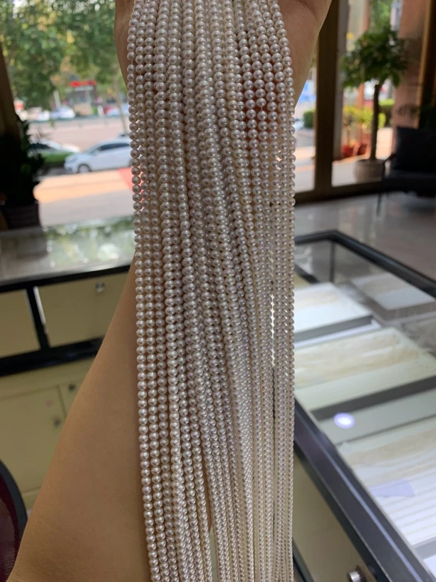 天然淡水极光白色近圆4-4.5m小米珠925银扣头