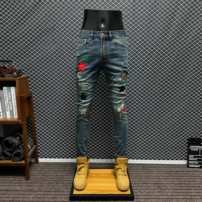 秋冬新款破洞牛仔裤男欧版潮流皮标水洗复古修身小脚休闲长裤子男