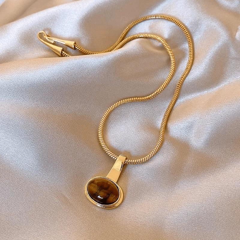 钛钢项链 美拉德椭圆虎眼石吊坠蛇骨毛衣链高级感轻奢小众项链潮