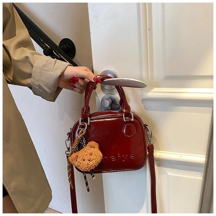 安哥拉红色手提小拎包女2024秋冬新款高级感轻奢小众保龄球斜挎包