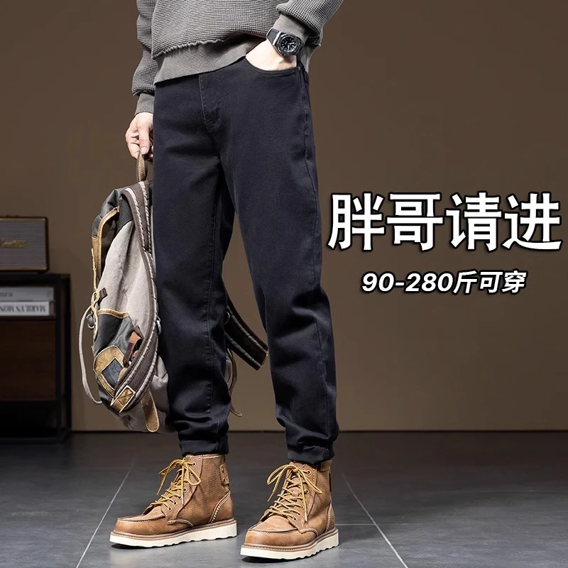 秋季纯黑色大码牛仔裤男士潮胖加肥加大弹力显瘦男裤宽松胖子裤子
