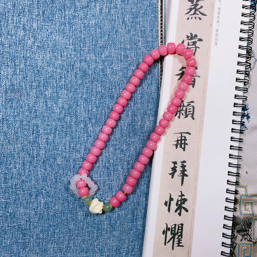 （粉黛佳人）粉菩提根手持双圈款搭配醒狮（盘玩袋）