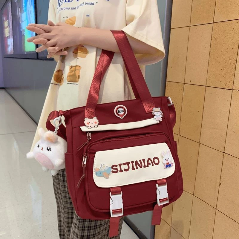 斜挎包女可爱百搭女学生韩版手提书袋初中小学生三到六年级补习袋