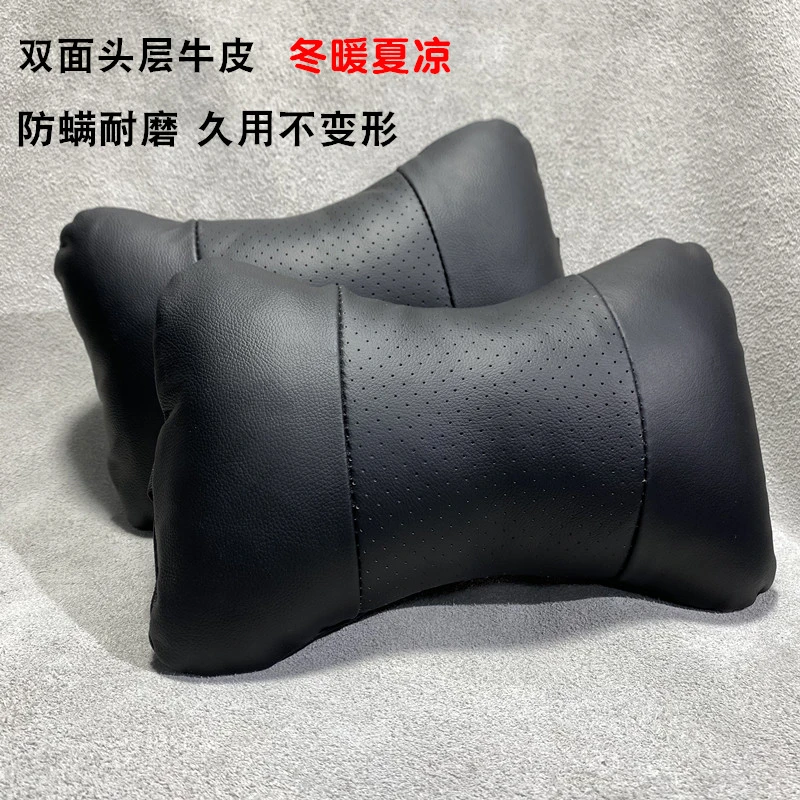 全真皮汽车头枕护颈枕靠颈枕车载用品通用黑色骨头枕正反全牛皮