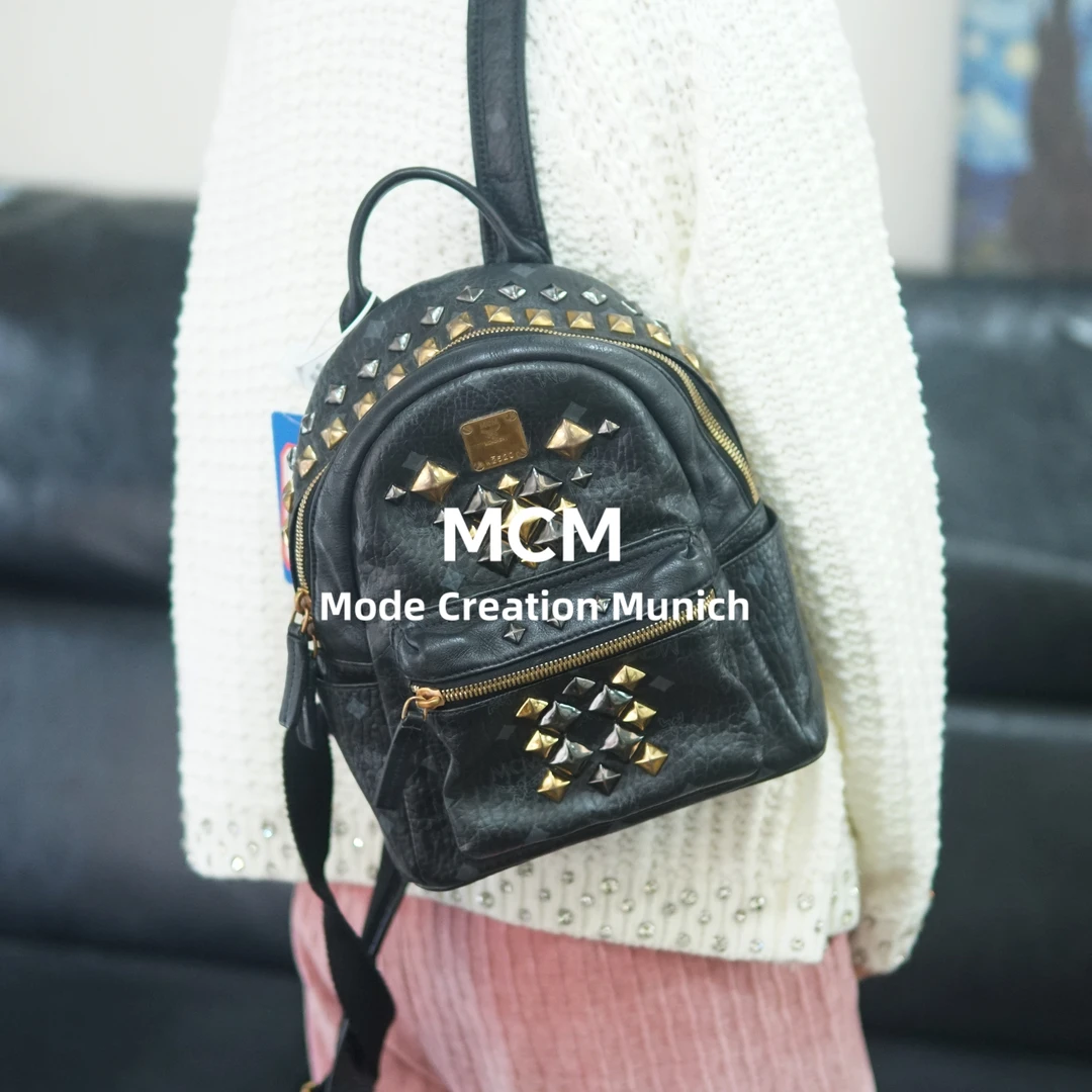 95新 MCM 黑金双肩包/F3TC07627086/7086