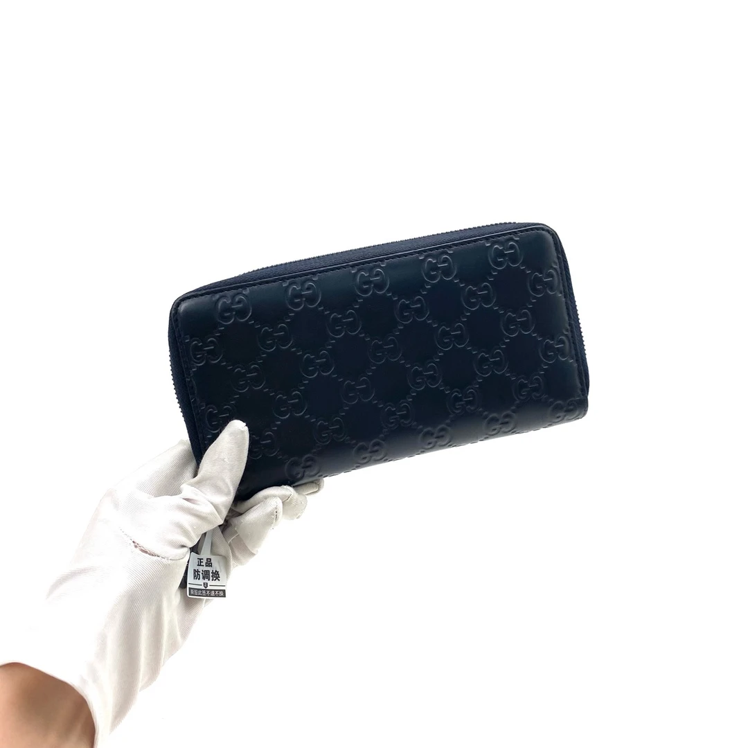 95新 GUCCI/古驰 男士休闲简约藏青色全皮压花拉链钱包 尺寸19/10