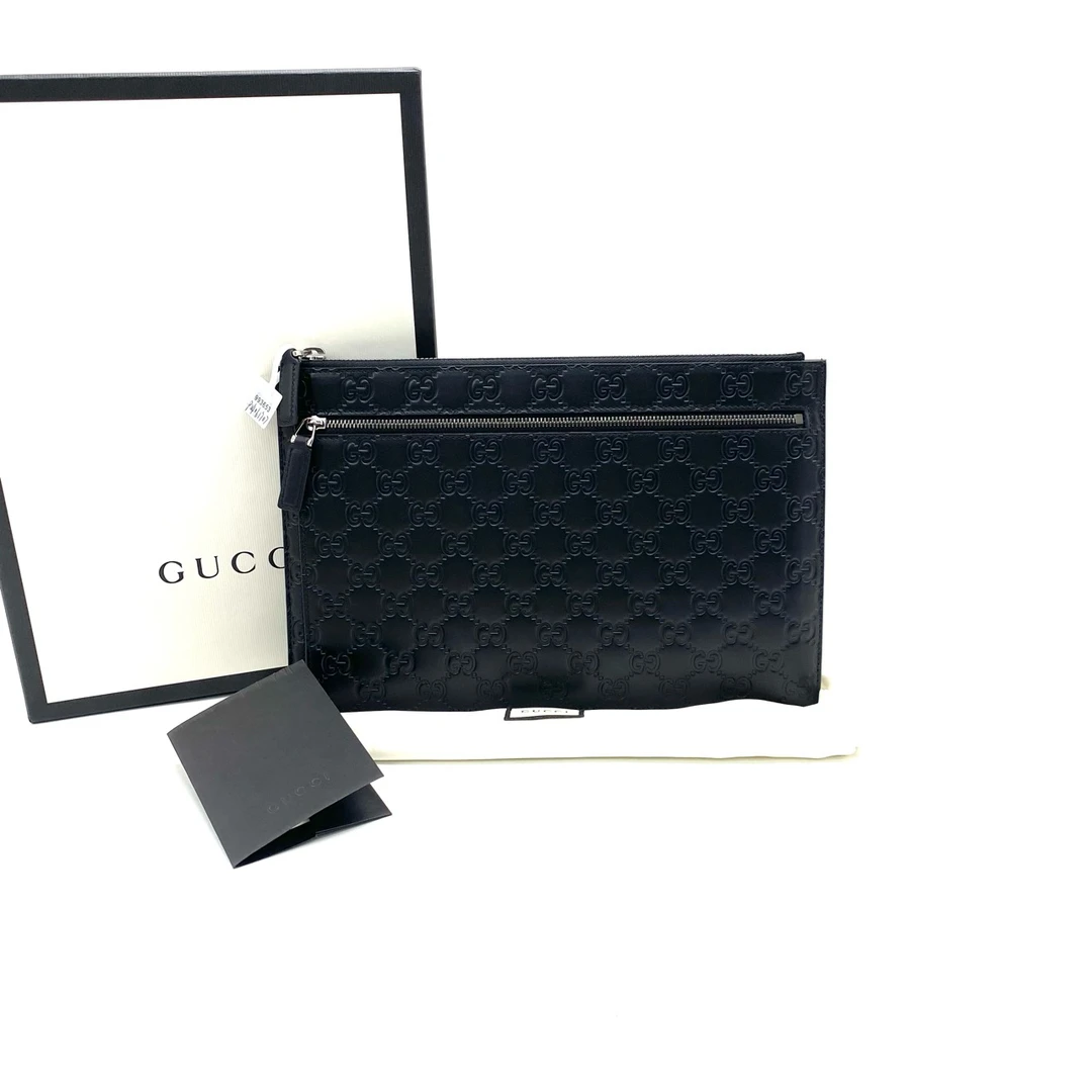 99新 GUCCI/古驰 男士时尚休闲黑色全皮压花手拿包 尺29/19