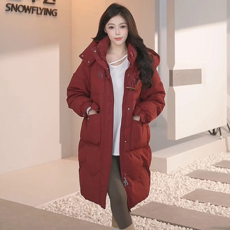 雪中飞中长款羽绒服时尚加厚牛角扣设计保暖冬季女