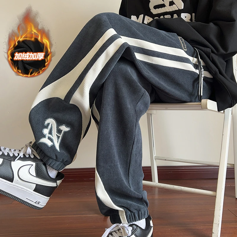 啄木鳥秋冬加绒加厚休闲裤宽松大码卫裤韩版百搭束脚裤运动裤子男