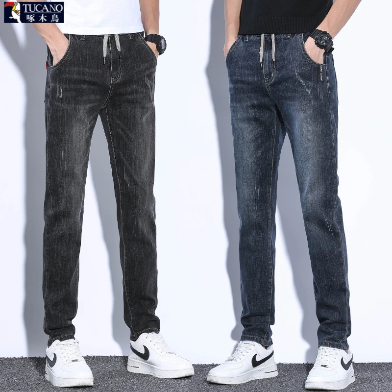 啄木鸟春秋款牛仔裤修身小脚男装2025年系绳韩版牛仔长裤松紧腰裤