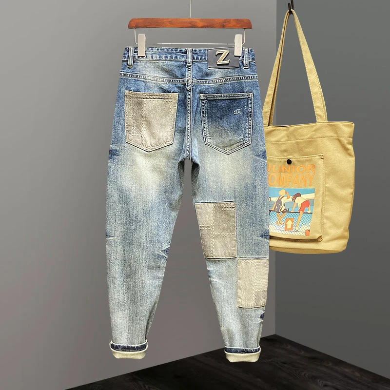 Jeep吉普痞帅拼接牛仔裤男潮牌修身小脚拼料补丁破洞休闲长裤男裤