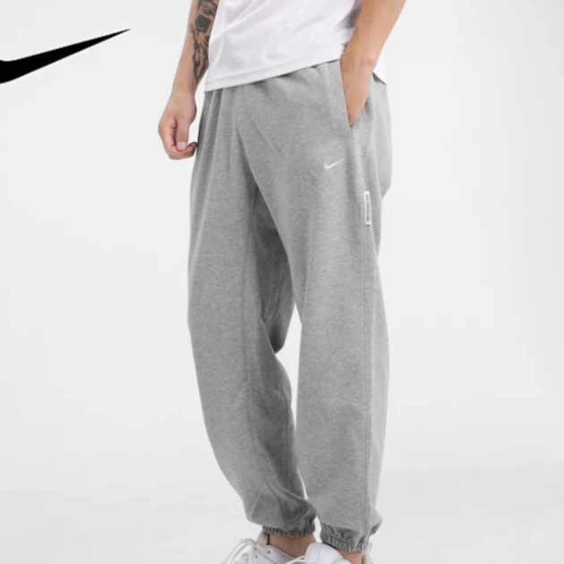 NIKE/耐克正版男女款DRI-FIT宽松运动裤束脚裤长裤CK6366-063