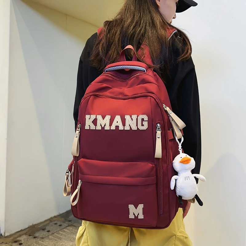 爆款机能高中生书包男简约初中生校园双肩背包女减负多层电脑包