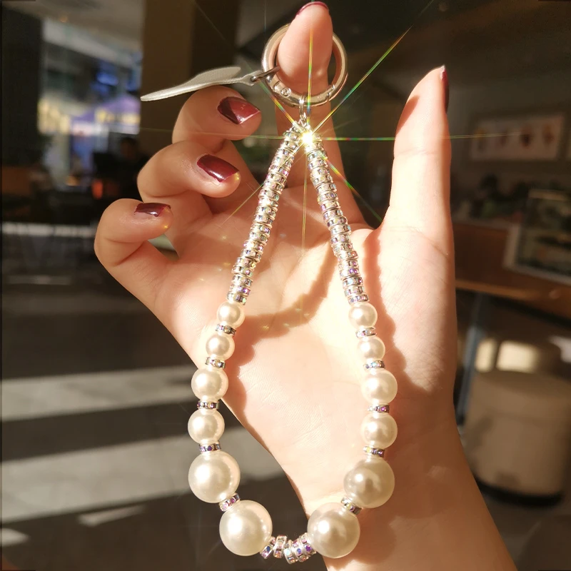 新款手机挂绳简洁时尚款水钻圈珍珠夹钻手链牢固防掉卡条手机通