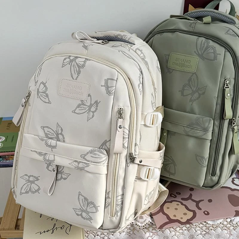 学生书包少女小学简约新款大容量双肩包大学生背包外高中生大容量