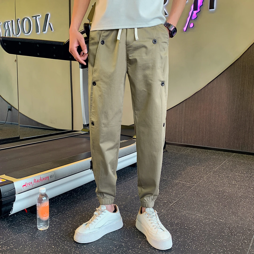 夏季潮款休闲工装裤男士松紧腰宽松束脚九分裤百搭排扣小脚哈伦裤