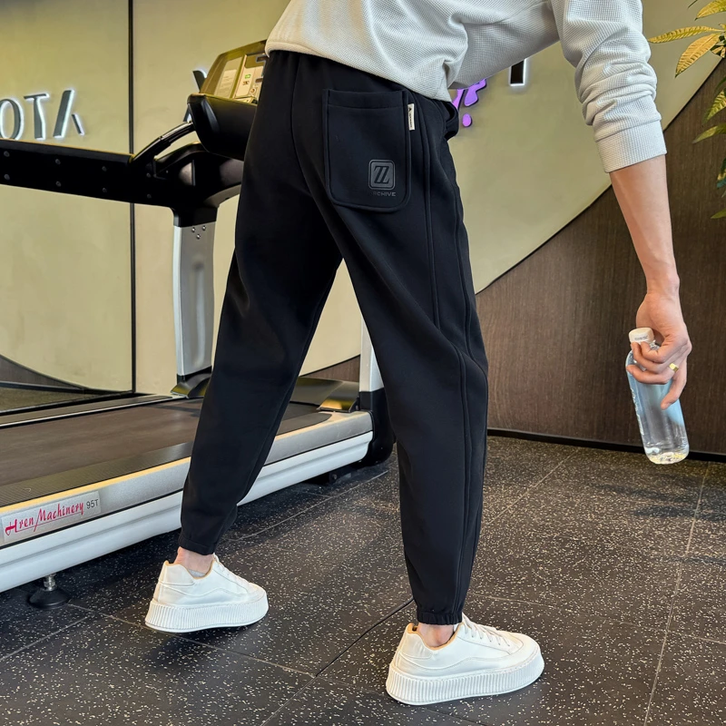 春秋新款束脚卫裤男潮牌高级感松紧腰抽绳运动裤黑色休闲裤子男