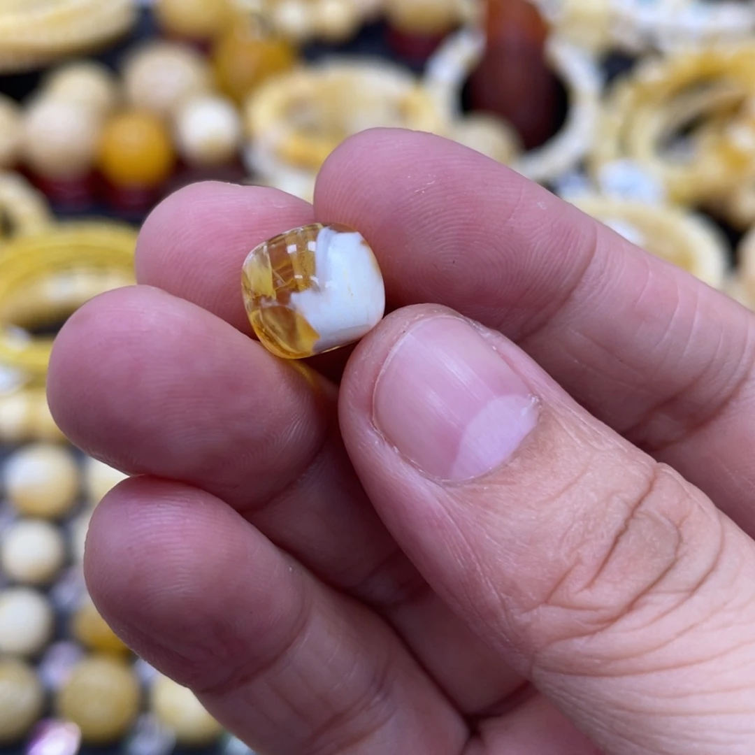 琥珀珠宝奇石未镶嵌11.9.7mm金瓷白溶洞 瑕疵