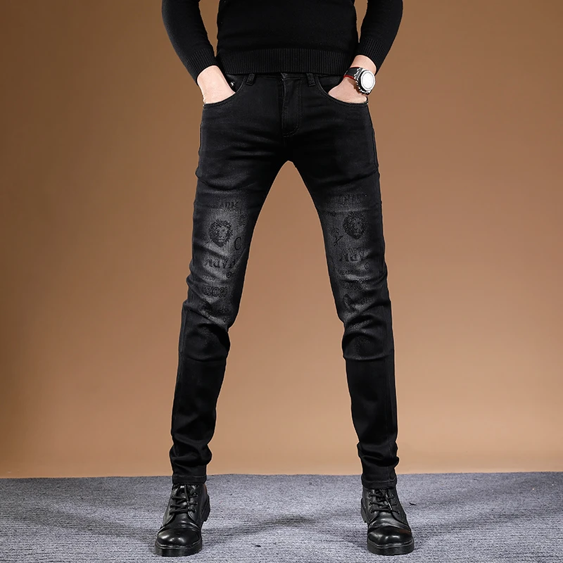 潮牌印花黑色男士牛仔裤男款秋冬款高端修身小脚弹力休闲男装裤子