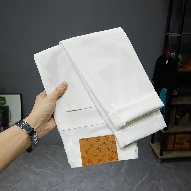 夏季薄款九分修身小脚牛仔裤男白色黑色高端订制韩版弹力修身长裤