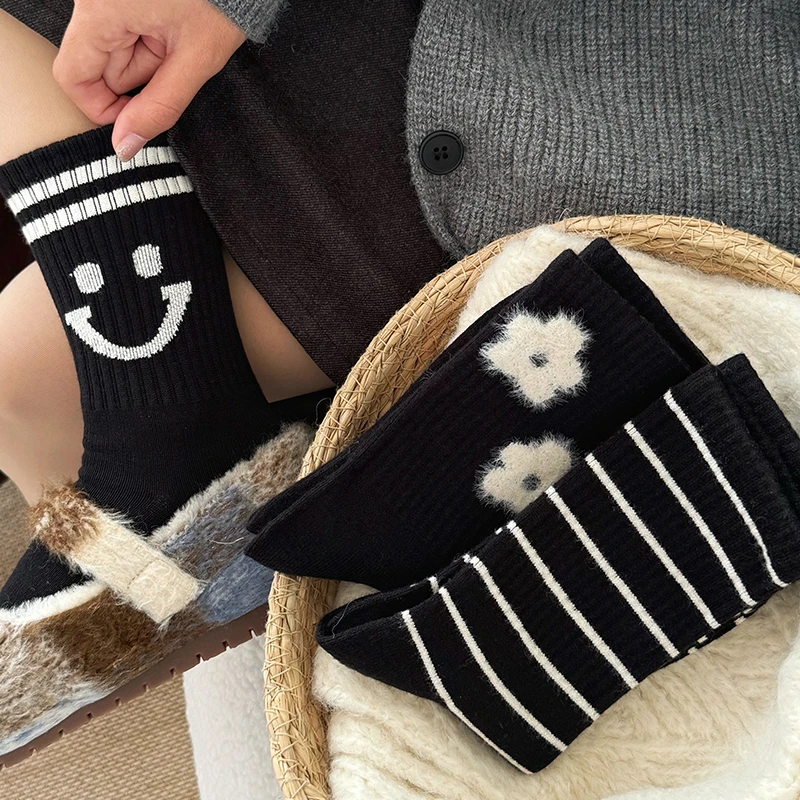 条纹羊绒袜子女中筒袜冬季加厚保暖甜美小花ins潮流黑色长袜外穿