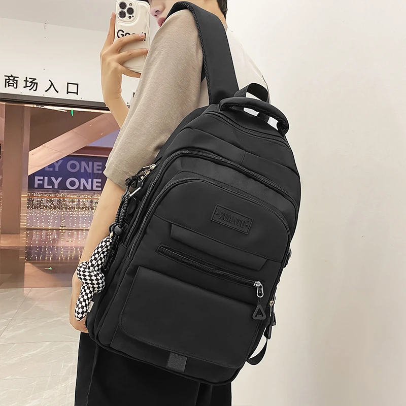 大牙书包男生初中高中大学生休闲百搭大容量双肩包夏季旅行背包女